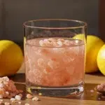 Pink salt trick drink in cozy kitchen setting