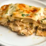 Cheesy Chicken Alfredo Lasagna with spinach Alfredo sauce and golden mozzarella, no ricotta.
