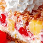 No-bake Millionaire Pie with whipped cream, toasted coconut, and pecans in a graham crust