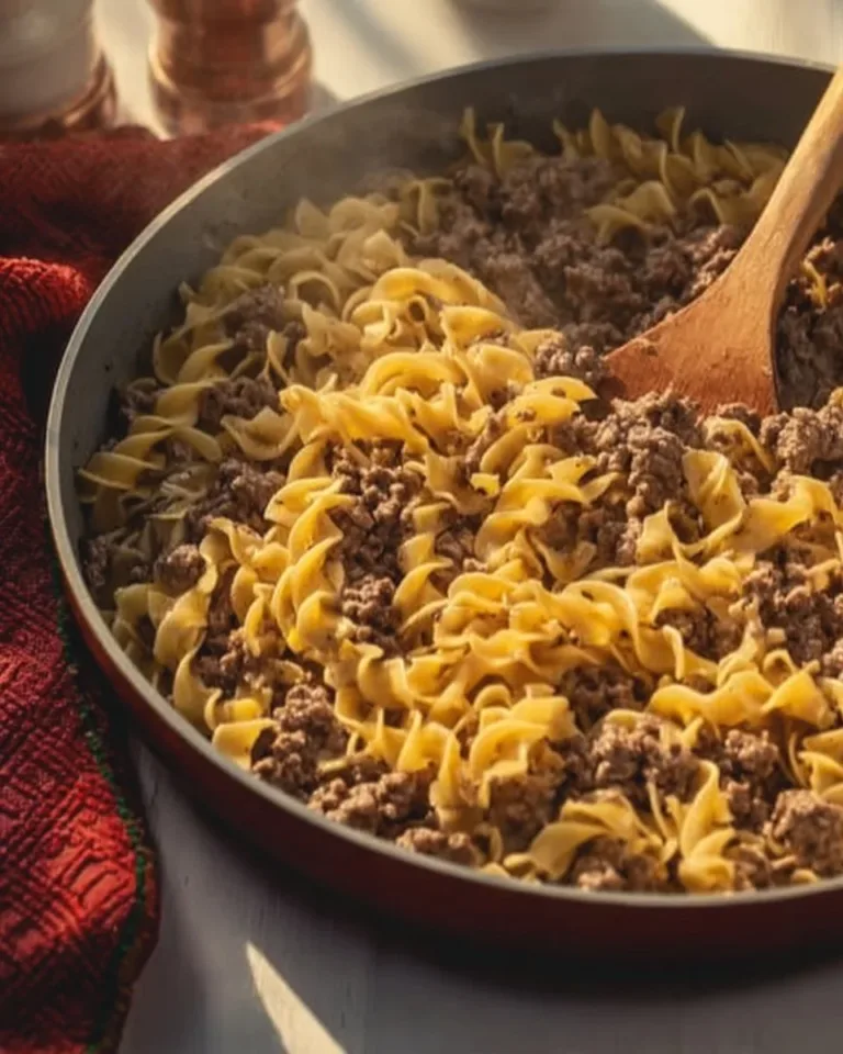 Delicious Ground Beef Stroganoff served on a plate, topped with fresh parsley.