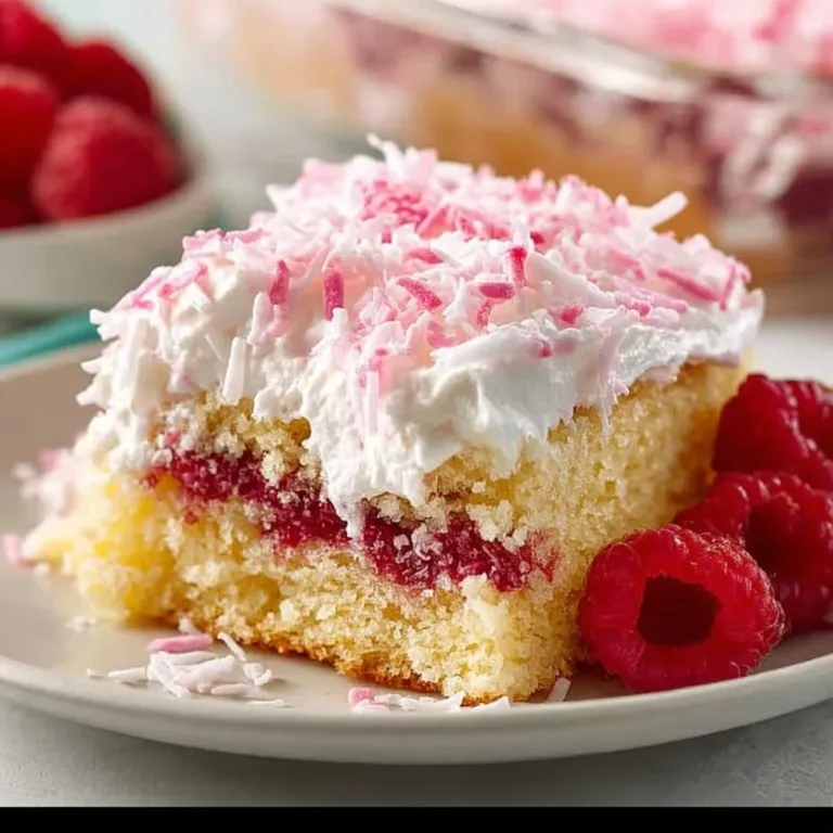 Delicious Raspberry Zinger Cake with fresh raspberries and creamy frosting.