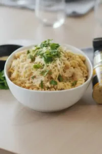 Crock Pot Buffalo Wild Wings Garlic Parmesan Chicken Pasta dish garnished with herbs