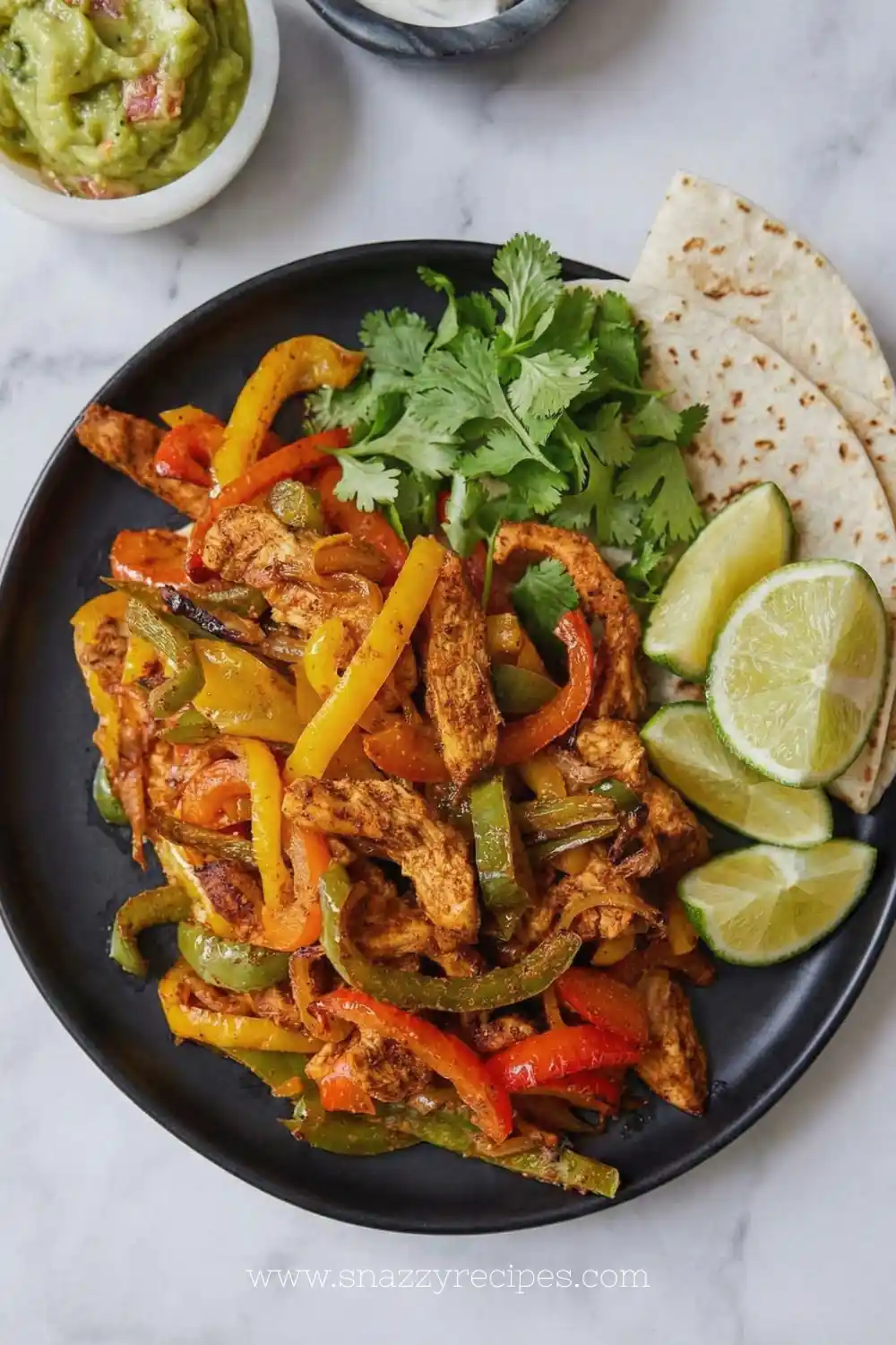 Delicious Air Fryer Chicken Fajitas with colorful veggies and spices.