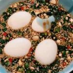 Delicious Korean marinated eggs served on a plate, showcasing vibrant colors.