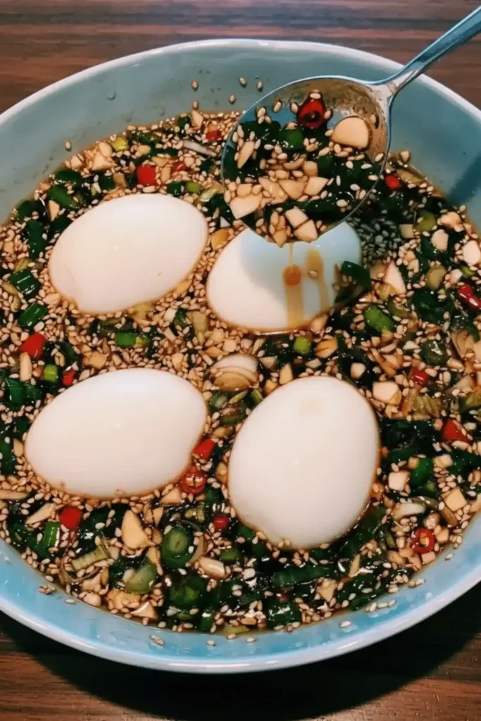 Delicious Korean marinated eggs served on a plate, showcasing vibrant colors.