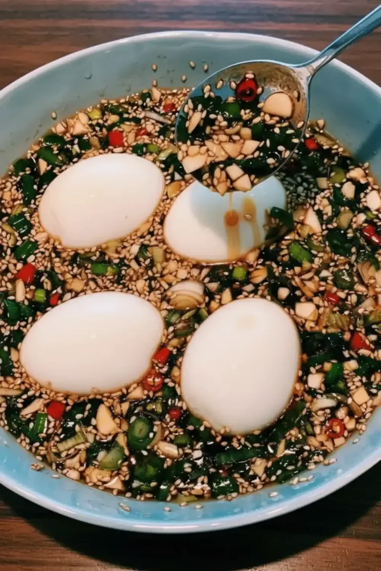 Delicious Korean marinated eggs served on a plate, showcasing vibrant colors.