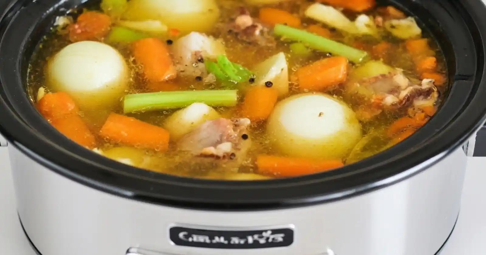 Delicious chicken bone broth with ginger and turmeric in a bowl