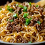 Mongolian Ground Beef Noodles served in a bowl with vibrant vegetables.