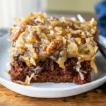 Delicious chocolate sheet cake topped with frosting and sprinkles